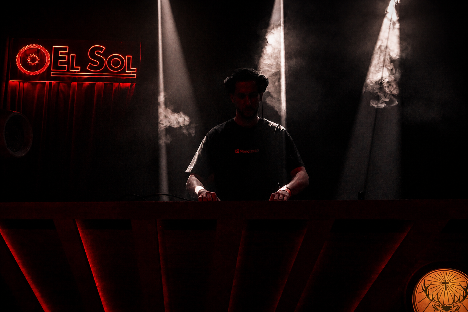 Bossa — DJ booth, smoke and El Sol signage