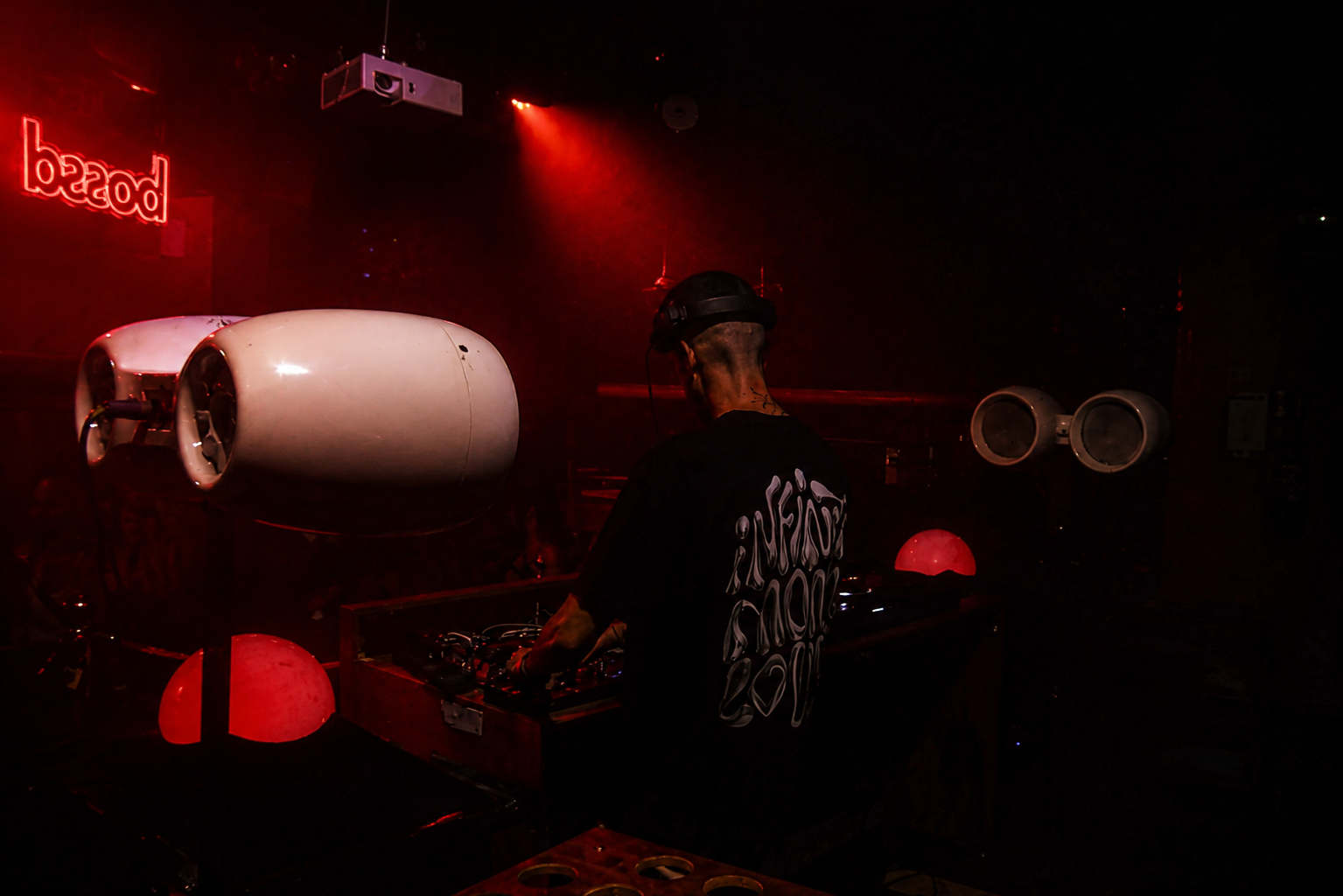 Bossa — artist at the booth under the brand signage